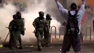 WARNING GRAPHIC CONTENT  US riot police use tear gas hit Portland protester with batons [upl. by Wennerholn]